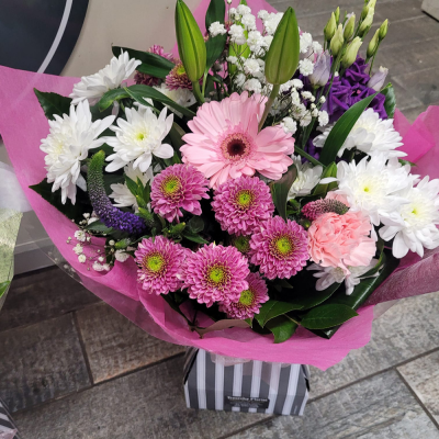 Cool Breeze - This classical stylish collection of flowers make this hand tied the perfect gift. Professionally arranged and delivered by a local florist. Flowers available for same day delivery when ordered before 2pm.
