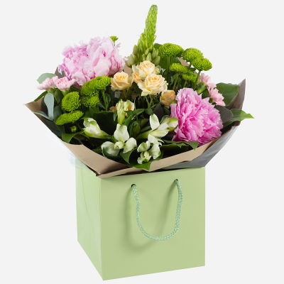 Delicate Touch - Subtle and sweet is the aura of this handtied. Containing a mixed collection of seasonal flowers and peonies.
