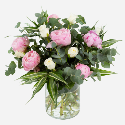 Pink Clouds - This dreamy vase arrangement promises to make a lasting impression. Beautiful peonies are combined with choice complementary flowers and foliage.