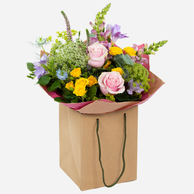 Coral Reef - An arrangement to bring joy and delight; with a stunning splash of summer hues and foliage.