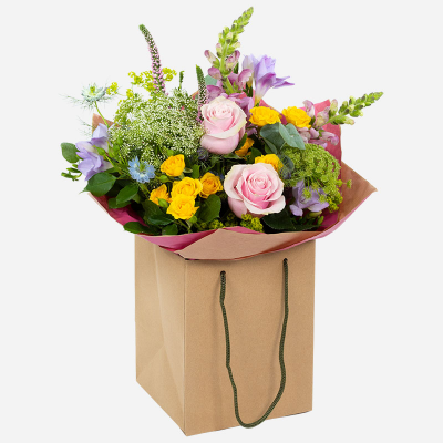 Coral Reef - An arrangement to bring joy and delight; with a stunning splash of summer hues and foliage.
