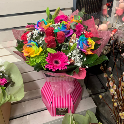 Tutti Fruit - This charming hand-tied floral arrangement looks good enough to eat. A delicious array of blooms with heads held high supported with glorious greenery.